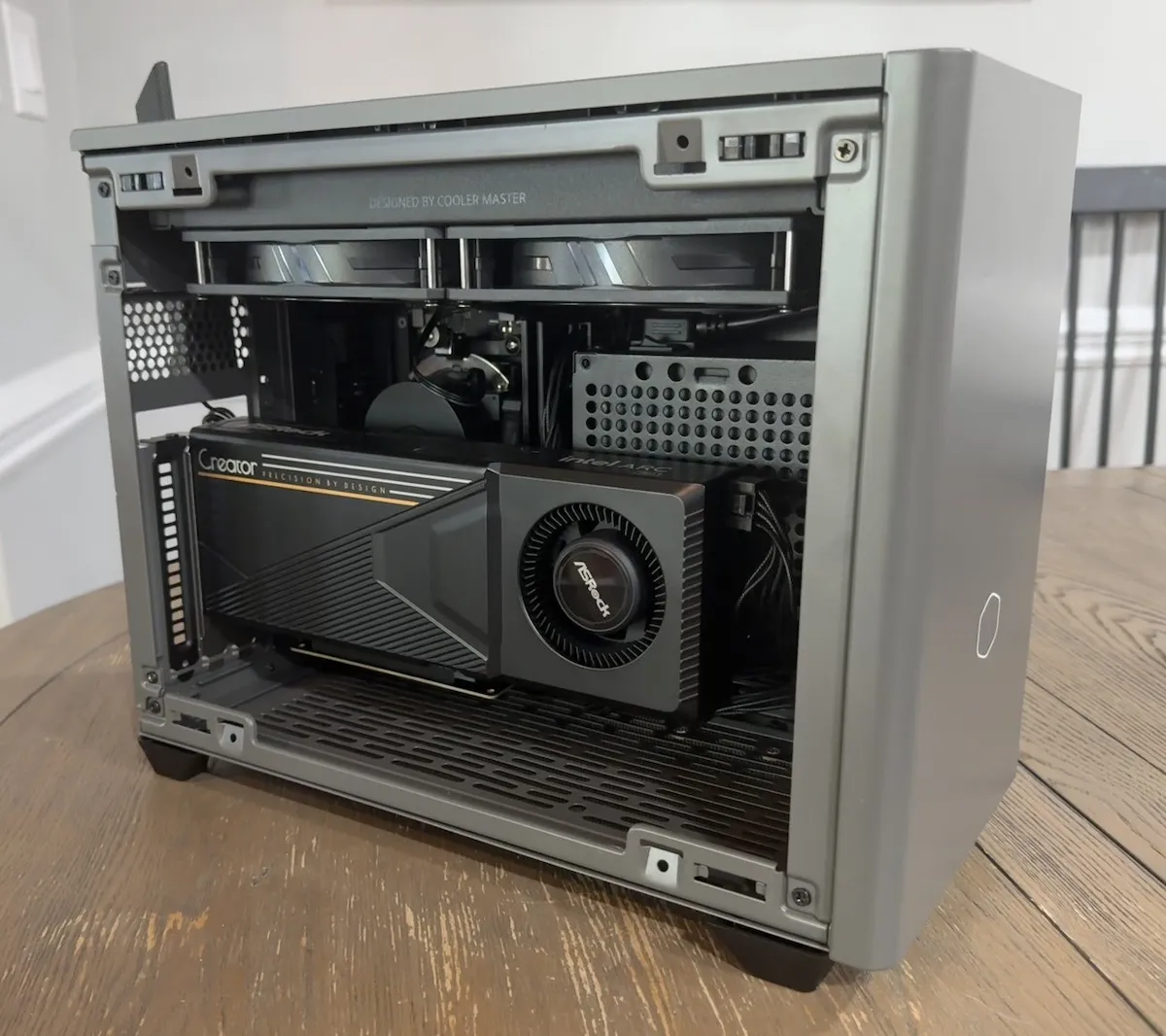 Intel Arc Pro B60 24GB graphics card installed inside a Cooler Master NR200P Max V2 Mini-ITX local AI PC build